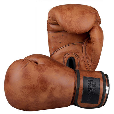 Pair of brown leather boxing gloves with a brand label