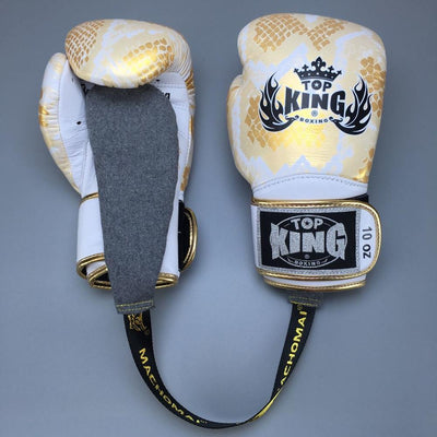 Pair of Top King boxing gloves on a gray background
