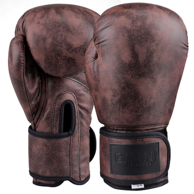 Pair of brown boxing gloves with visible brand logo on a white background