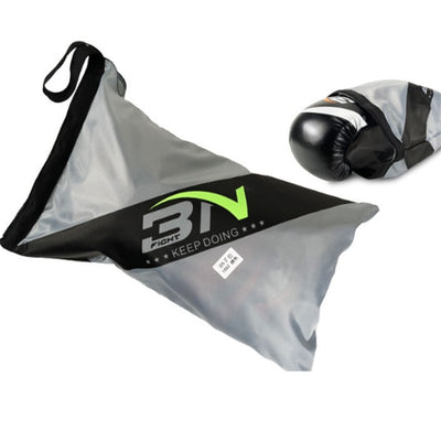 Gray sandbag with black straps and green logo, next to a black boxing glove on a white background