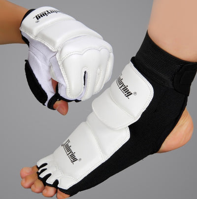 White martial arts gloves and foot guards with black accents