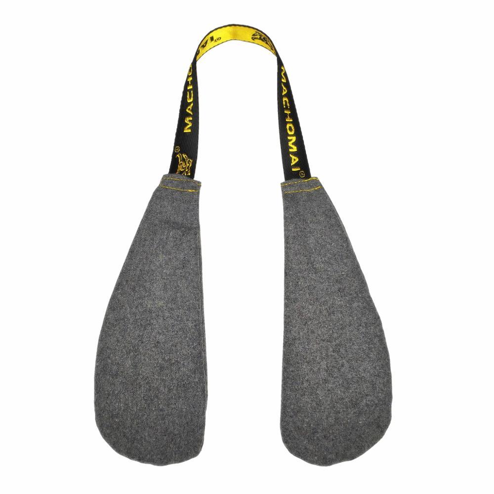 Gray dog toy with yellow handle on a white background