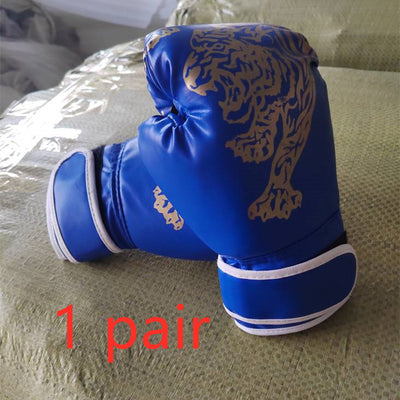 Blue boxing gloves with gold tiger design on a textured surface