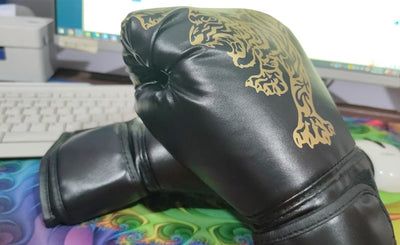 Black boxing glove with gold design